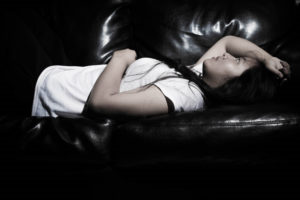 Photo of girl laying on a couch by Sodanie Chea via Flickr