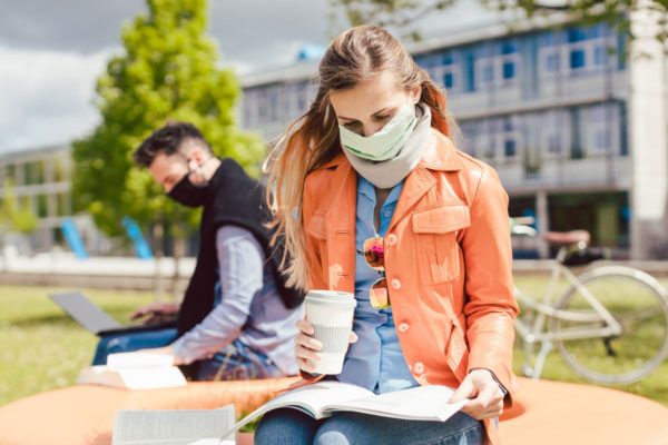 College Students Wearing Masks And Staying Distant During Covid
