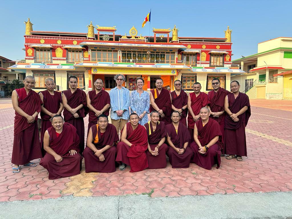 Tidwell and Goldman (standing center) with the Units A and B field teams at Mundgod monastery in India.