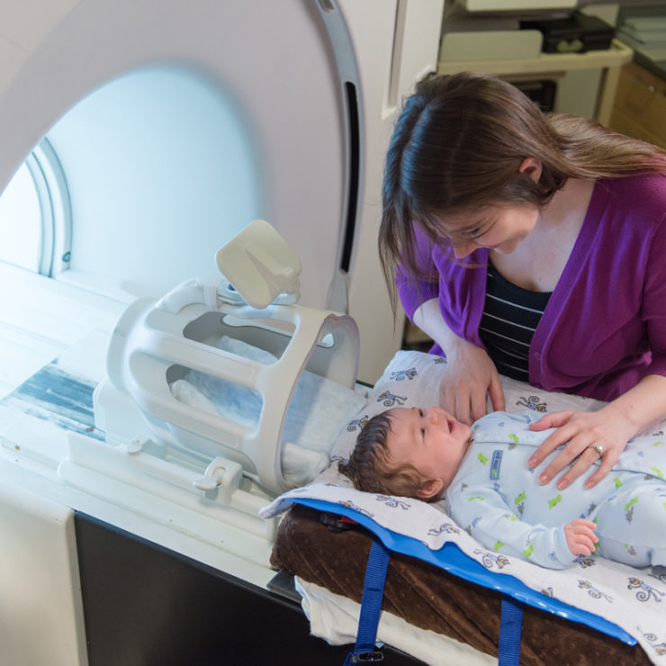 Infant and mother in imaging room for Baby Brain and Behavior Project