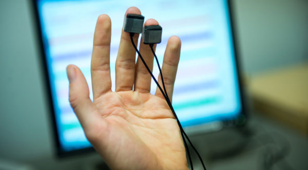 Photo of hand sensor collecting pulse from Center for Healthy Minds
