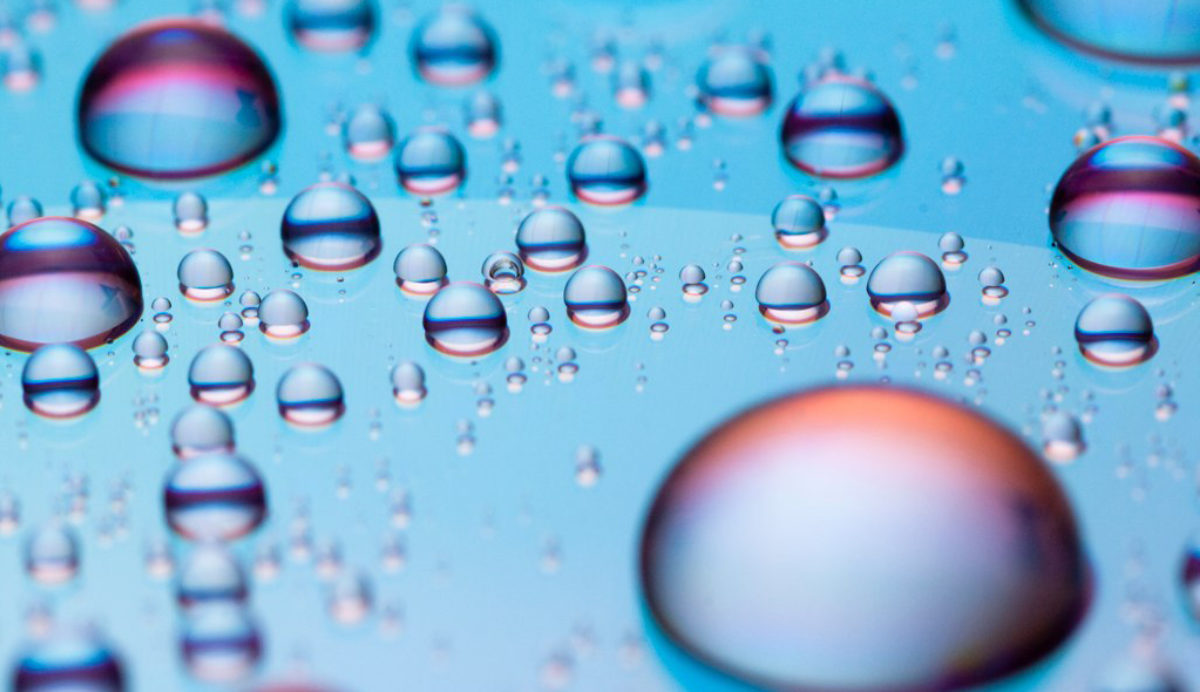 Closeup of illuminated water droplet by Jason Devaun via Flickr