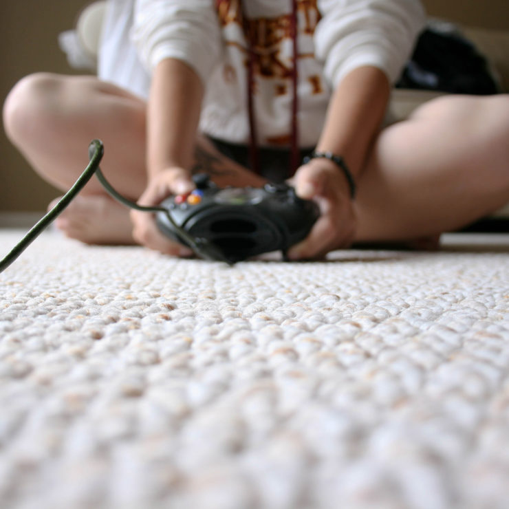 Photo of child playing a video game by Chapendra from Flickr