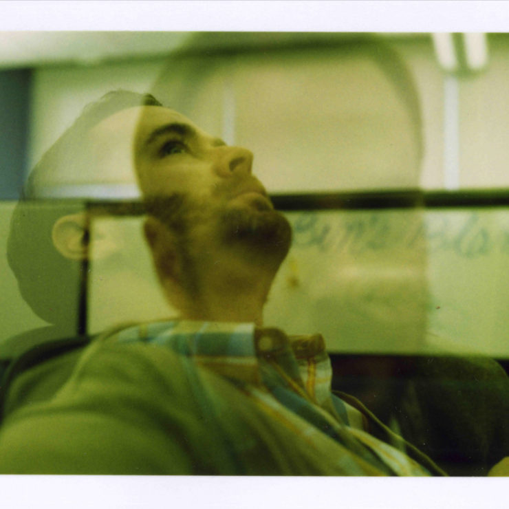 Photo of a man looking up and daydreaming by benprks via Flickr