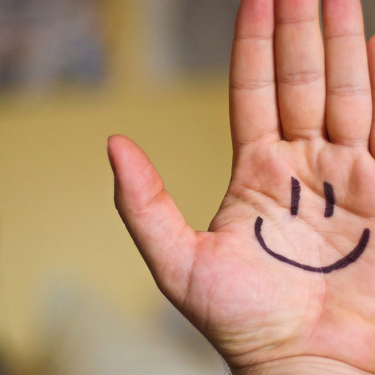 Hand with happy face drawn on by Ben Smith via Flickr