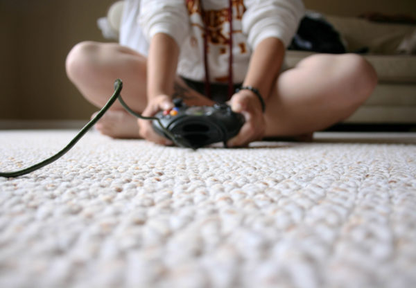 Photo of child playing a video game by Chapendra from Flickr