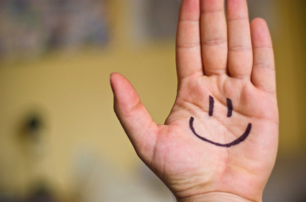 Hand with happy face drawn on by Ben Smith via Flickr