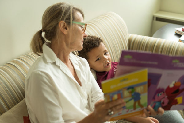 Woman Reading To A Child
